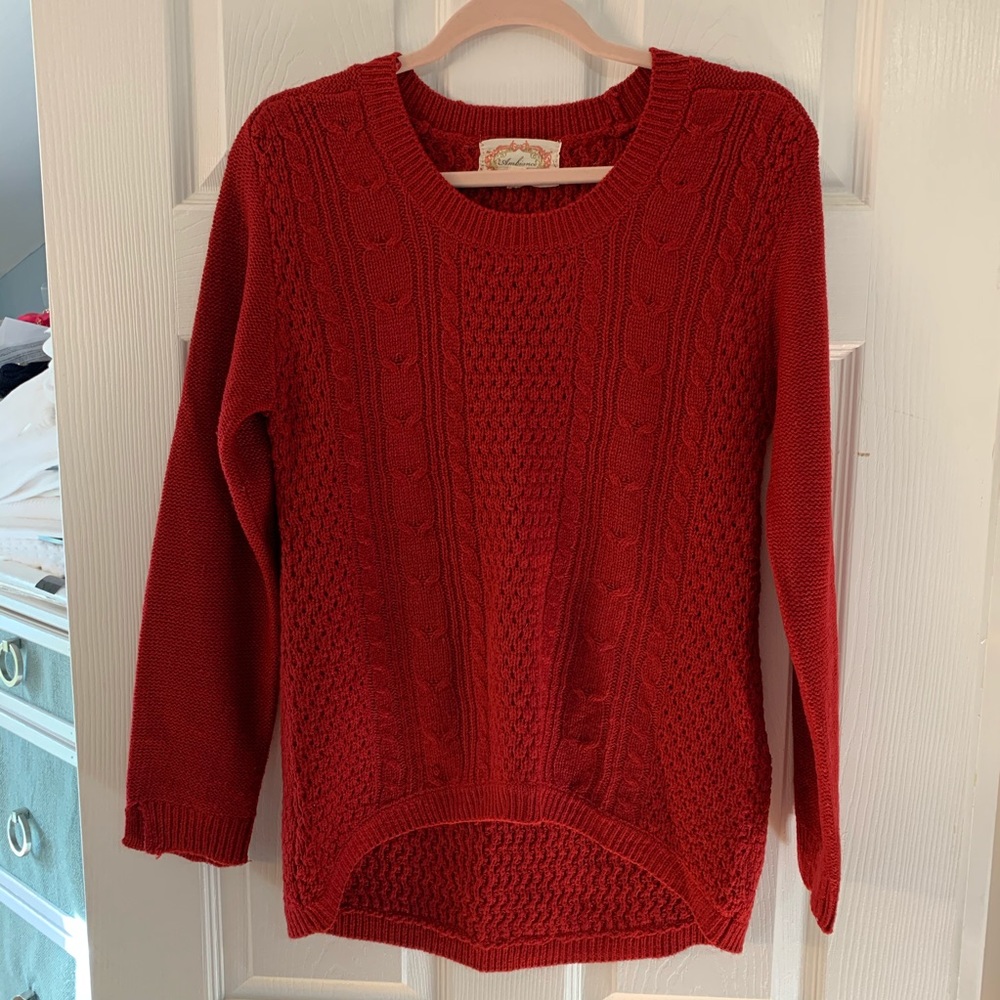 Red knit sweater longer in back
